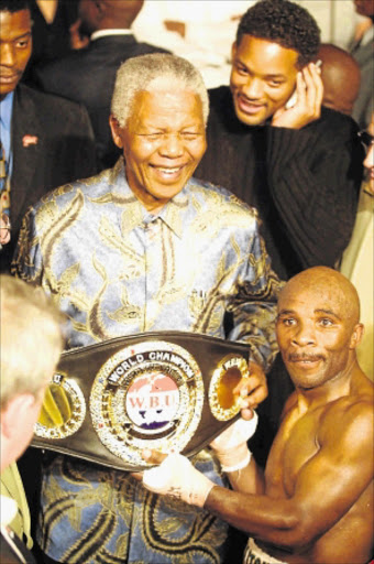 CHAMPS: Nelson Mandela and Baby Jake Matlala after his last fight, at Carnival City PHOTO: Sydney Seshibedi