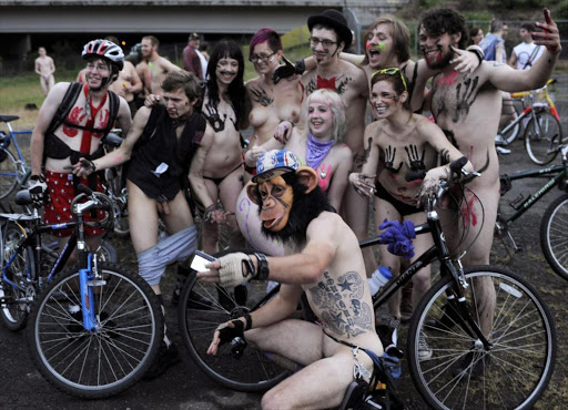 Participants pose for a group photograph before taking part in the annual World Naked Bike Ride in Portland, Oregon June 18, 2011. World Naked Bike Ride is a globally observed event among hard-core bikers designed, at least ostensibly, to promote the use of the bicycle for transportation. But Portland cyclists have been especially adamant about making it another of the Pacific Northwest city's quirky traditions. `