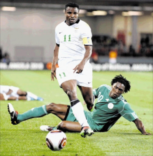 GOAL POACHER: Collins Mbesuma (left) is in the Chipolopolo squad while top marksman Chris Katongo in the white jersey (top) was left out of the team to face the Warriors in Harare next month Picture: GALLO IMAGES