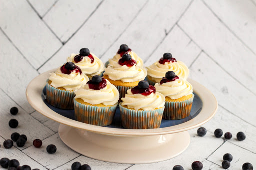 A plate of Bursting Blueberry Cupcakes.