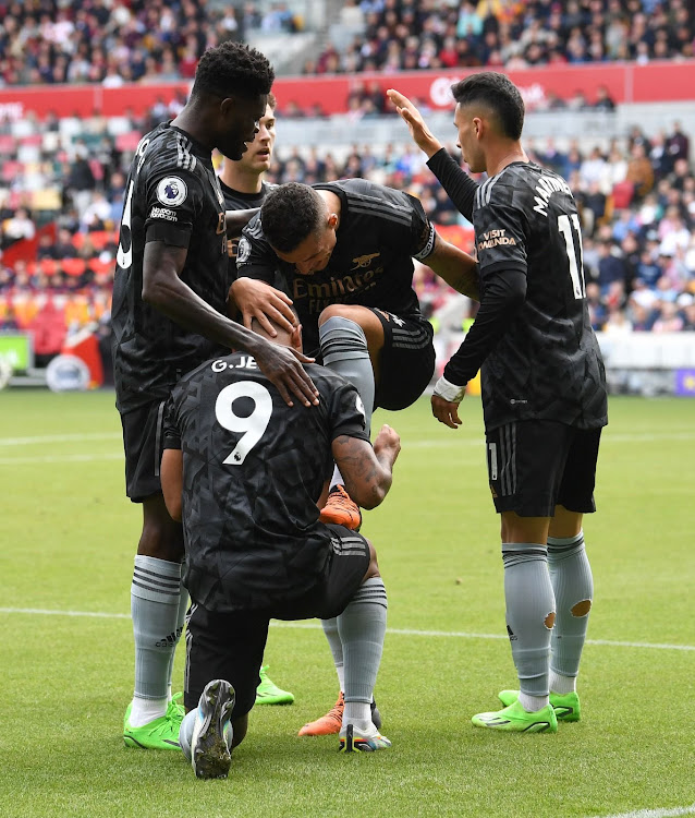 Arsenal players celebrate in a past match