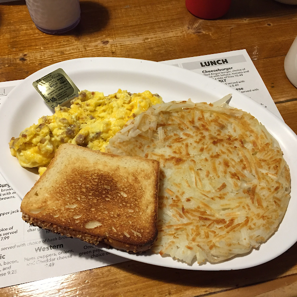 Scrambled eggs with sausage and cheese; toast and hashbrowns