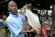 Jacinto Nhaposse is making a living by selling fish at  a fish market at the Costa do Sol beach in Maputo. 