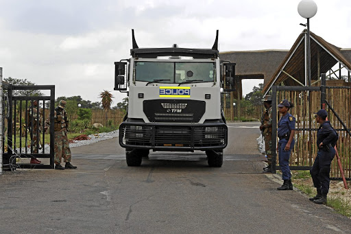 Police officers and soldiers on guard at the entrance to the Ranch Resort, near Polokwane in Limpopo, where South Africans who were evacuated from China are in quarantine.