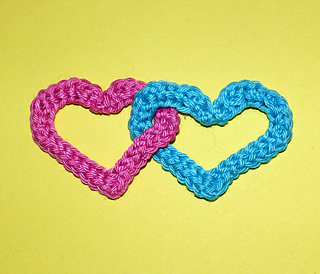 two hearts joined together on a yellow background