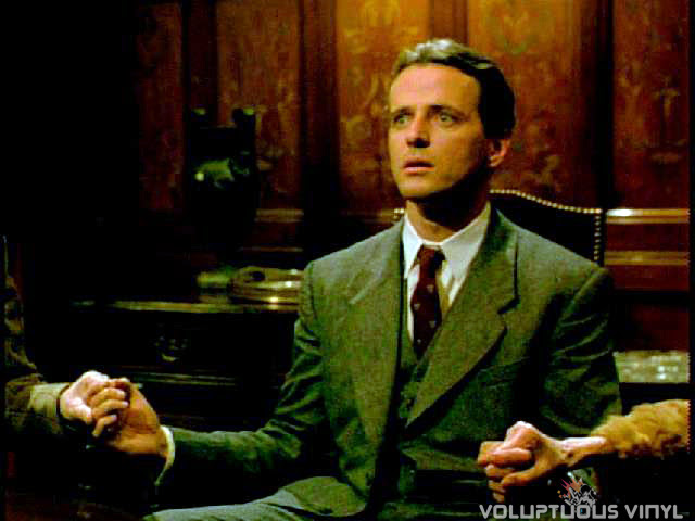 Aidan Quinn at a seance in the film Haunted.