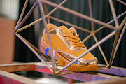 The BathuXSomizi sneaker is available in four bling colours, including gold, pictured.