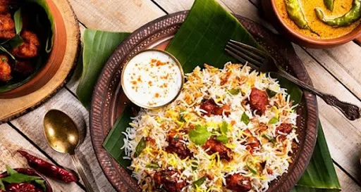 Chicken Tikka Biryani + Raita+ Gravy + Salad + Gulab Jamun