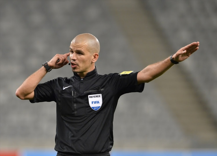 Victor Gomes match referee writes up a yellow card during the Absa Premiership match between Chippa United and Cape Town City FC at Nelson Mandela Bay Stadium on November 19, 2016 in Port Elizabeth.