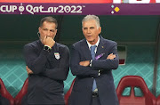 Iran coach Carlos Queiroz (right) and assistant coach Roger De Sa during the World Cup group B match against England at Khalifa International Stadium in Doha, Qatar on November 21 2022.