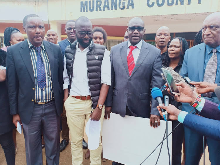 Thirdway Alliance party leader Ekuru Aukot (in red tie) and members of Murang'a County Assembly.