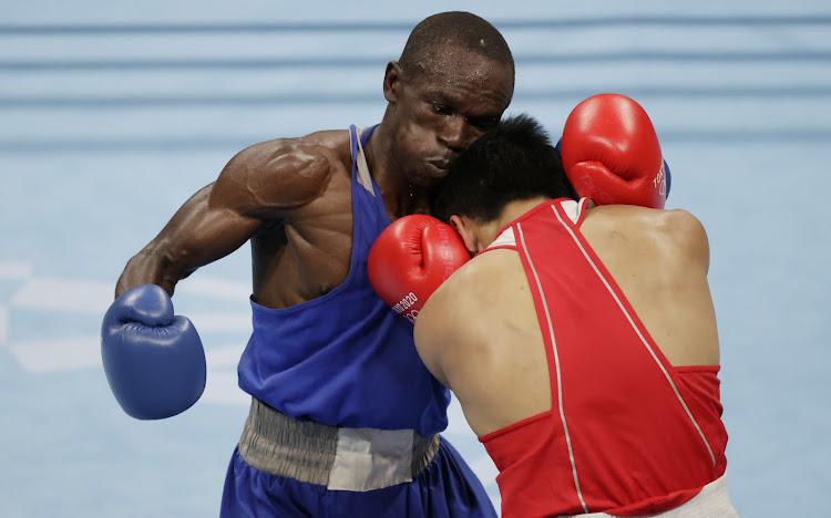 Nick Okoth of Kenya in action against Erdenebat Tsendbaatar of Mongolia at the 2020Tokyo Olympic Games.