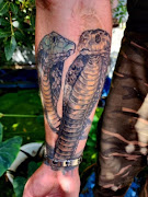 Rico Pentz had this snake tattoo done to cover a previous bite after a skin graft treatment.