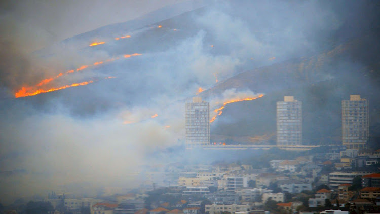 The fire and smoke over Cape Town in an image taken at 7.30am.