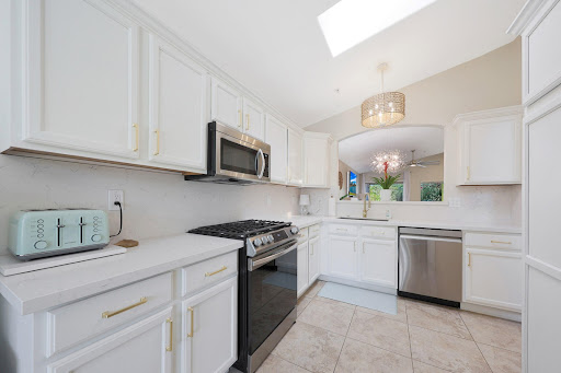 Modern white kitchen with stainless steel appliances - Rent this luxury property in Scottsdale, 3 bedrooms
