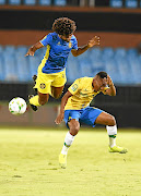 Augusto Carneiro  of Petro du Luanda and Lebohang Maboe of Mamelodi Sundowns during their  CAF Champions League match.