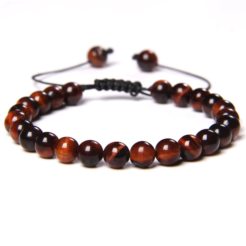 Bracciale in occhio di tigre naturale intrecciato per donna, un accessorio elegante e protettivo, perfetto per ogni occasione e look.