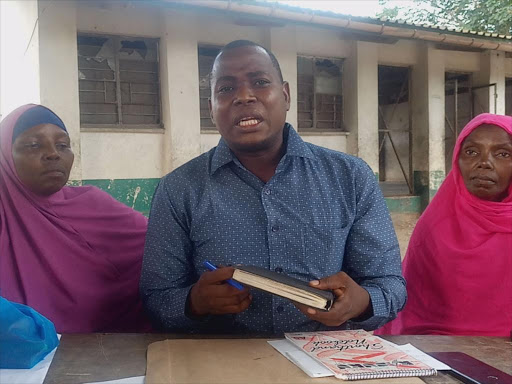 Basuba ward MCA Deko Barissa flanked by Boni mothers.