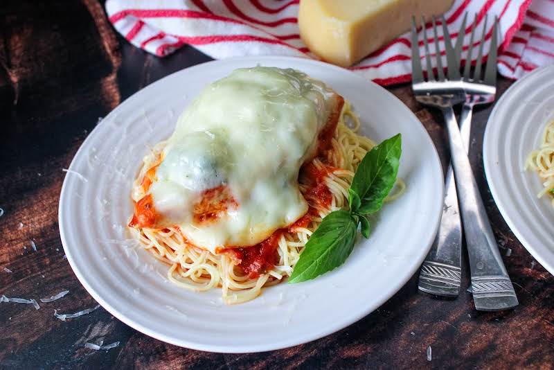 Chicken Annabella On A Plate With Angel Hair Pasta.