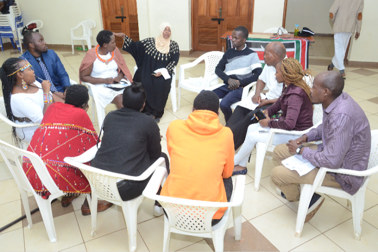 Youths engaging in discussions about the peace during the elections.