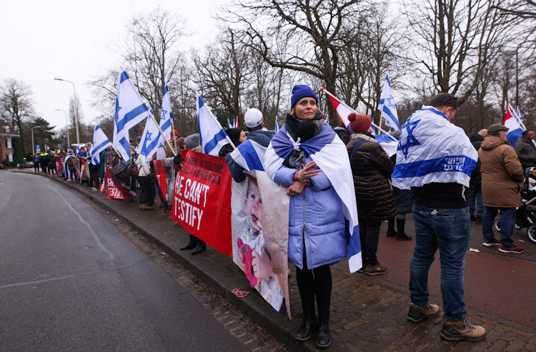 Pro-Israeli protesters gather near the International Court of Justice in The Hague as judges hear an application brought by South Africa to order the Jewish state to stop its military offensive in Gaza. The South African Zionist Federation says the court has disappointed the South African government by failing to grant its request for the order that Israel immediately cease the war in the Gaza Strip.