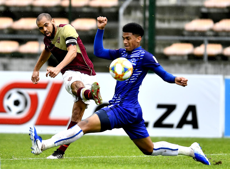 Jarrod Moroole in action against Rushine De Reuck of Maritzburg United during an Absa Premiership match at Athlone Stadium.