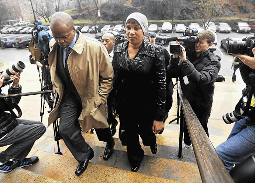 CLOSING A BAD CHAPTER: Nafissatou Diallo, the hotel housekeeper who accused former IMF chief Dominique Strauss-Kahn of sexually assaulting her, outside a New York state court. Lawyers for Strauss-Kahn and Diallo settled over her civil lawsuit against him