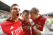 Arsenal playrs celebrate one of the goals against Watford. 