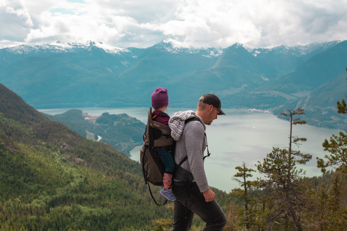 dad and daughter with view over mountains 