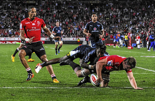 Kwagga Smith of the Lions scores a try in their Super Rugby match against Vodacom Bulls at Emirates Airline Park in Johannesburg yesterday.