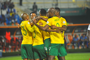 Bafana Bafana players celebrate a goal by Percy Tau during the Africa Cup of Nations match against Namibia at Stade Amadou Gon Coulibaly on January 21 2024 in Korhogo, Ivory Coast.