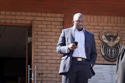 Zondwa Mandela, grandson of Nelson Mandela, leaves the Randburg Magistrates court in Johannesburg, South Africa on 11 May 2011 after appearing on charges of speeding. Mandela, CEO of embattled mining company Aurora Empowerment Systems, was allegedly caught driving at 158km an hour in a residential area in Fairland, Johannesburg, on Saturday night. (Photo by