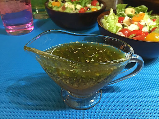 Healthy and fresh made Greek Salad Dressing with herbs