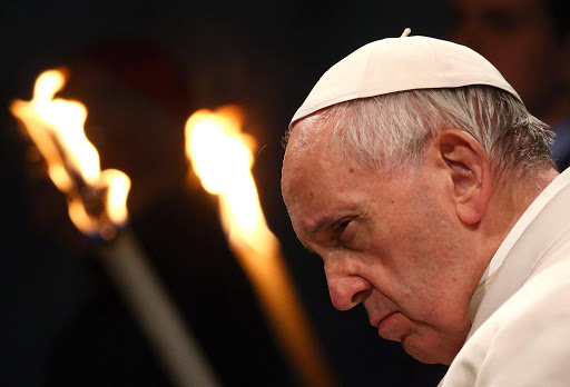 Pope Francis leads the Via Crucis (Way of the Cross) procession during Good Friday celebrations in front of the Colosseum in Rome, Italy, April 14, 2017. REUTERS/Alessandro Bianchi