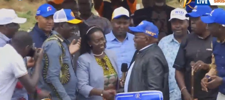 Azimio presidential candidate Raila Odinga and his running mate Martha Karua receive Kipruto Kirwa who has defected from UDA party.