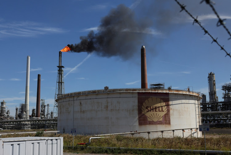 An oil tank of Shell is seen as a pilot flame burns atop a flare stack at the refinery of the Shell Energy and Chemicals Park Rheinland in Godorf, Germany on August 3 2022. Picture: REUTERS/WOLFGANG RATTAY