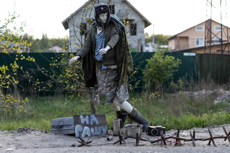 A mannequin depicting a Russian soldier is seen with a sign reading 'to Russia' in an abandoned check point in Borodyanka, outside Kyiv, Ukraine, on May 16 2022.