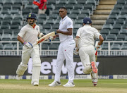 Virat Kohli and Cheteshwar Pujara of India in partnership during day 1 of the 3rd Sunfoil Test match between South Africa and India at Bidvest Wanderers Stadium on January 24, 2018 in Johannesburg.
