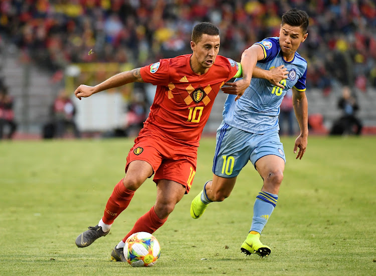 Belgium's Eden Hazard in action with Kazakhstan's Georgi Zhukov