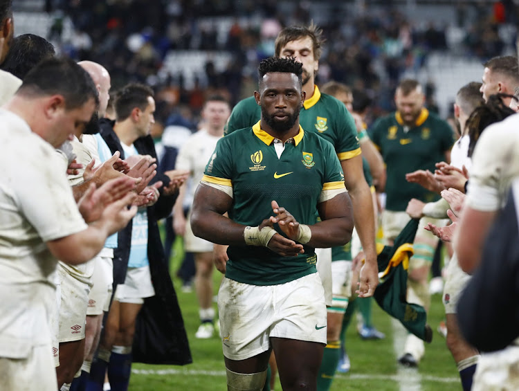 England applaud the Springboks, led by captain Siya Kolisi, off the field after South Africa's 2023 Rugby World Cup semifinal victory at Stade de France in Paris on Saturday night.