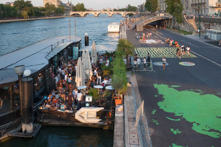 The banks of the Seine in Paris include some floating discos, bars and restaurants.