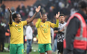Bafana Bafana scorer Percy Tau and Thapelo Morena celebrate a famous win in their Africa Cup of Nations qualifier against Morocco at FNB Stadium on June 17 2023.