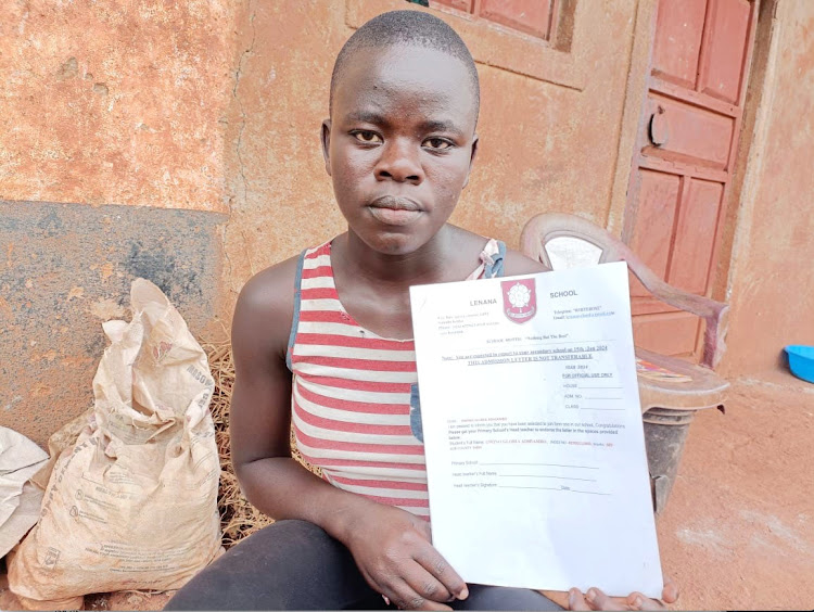 Gloria Adhiambo Owino with her admission letter for Lenana School, a boys’ school in Nairobi /KNA