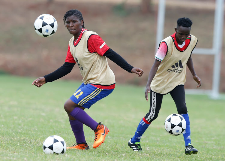 Josephine Kwamboka and Esther Moraa in training at the Moi Stadium, Kasarani ahead of the Deaflympics qualifiers.