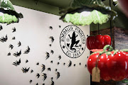 The brand's distinctive ceramic swallows – in various sizes – swoop across a wall in Bordallo Pinheiro's Cape Town store.