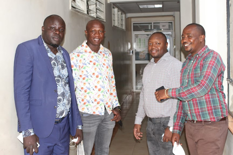 From left John Abok, Kenneth Odhiambo, Richard Bosire and Joseph Mwangi at the Milimani Magistrate when they were freed.