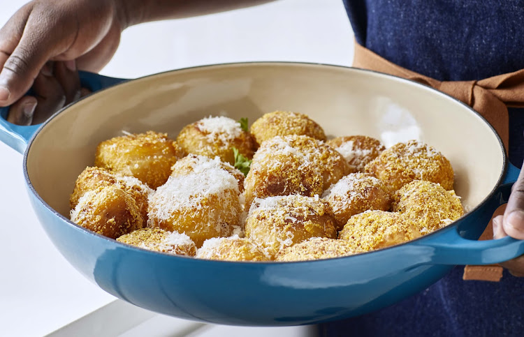 Roast potatoes with a polenta crust and Parmesan.