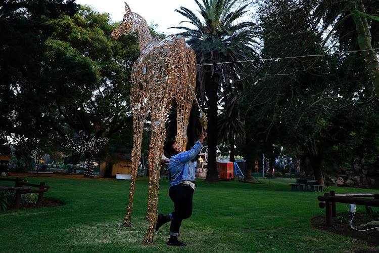 Tebogo Masemola with one of the animals that would have been on display at the Festival of Lights at Joburg Zoo.