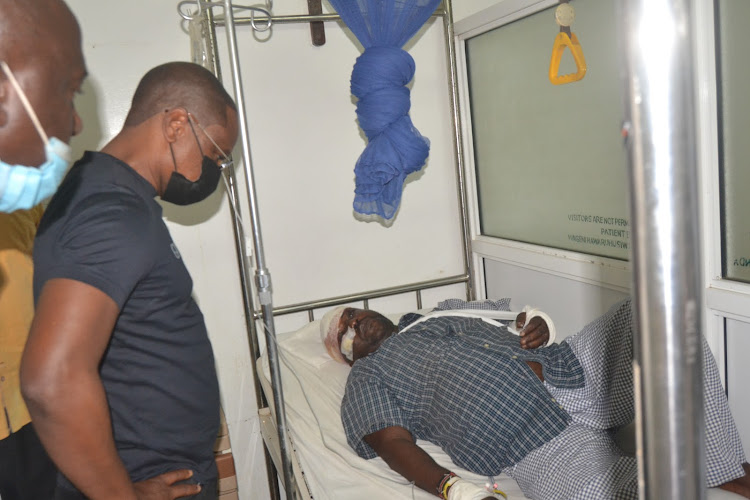 Kilifi Governor Amason Kingi consoles one of his staff members injured during the accident at Kwamkikyuyu along the Malindi Mombasa highway