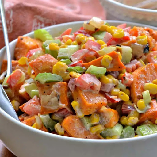 Sweet Potato Salad is a perfect combination of sweet, savory, and a little spice! Tossed together with a creamy homemade dressing, this sweet potato salad is the perfect side dish for summer parties, potlucks, and picnics.

